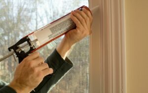 caulk-drafty-windows-winter-home-energy-saving-tips-Cumming-Home